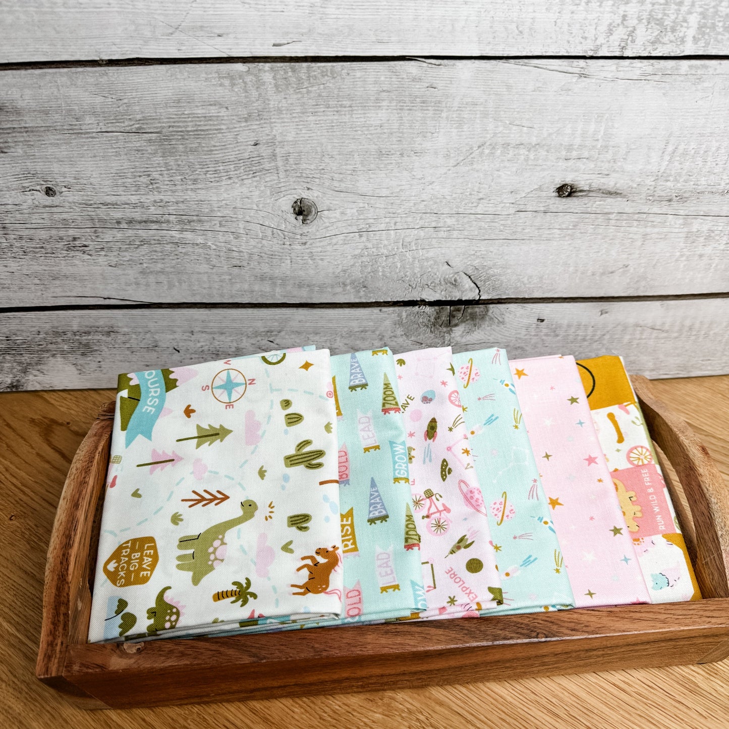 Six-piece Brave Your Way petite fat quarter bundle in Petal and Songbird pink and mint fabrics, by Cayla Naylor for Riley Blake Designs.