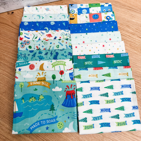 Seventeen-piece Brave Your Way fat quarter bundle by Cayla Naylor for Riley Blake Designs, featuring blue, teal, and green fabrics.