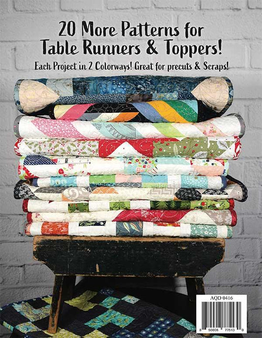 Back cover of Tabletastic 2! book. Stack of colorful quilted table runners on a wooden stool with text about patterns for table runners and toppers.
