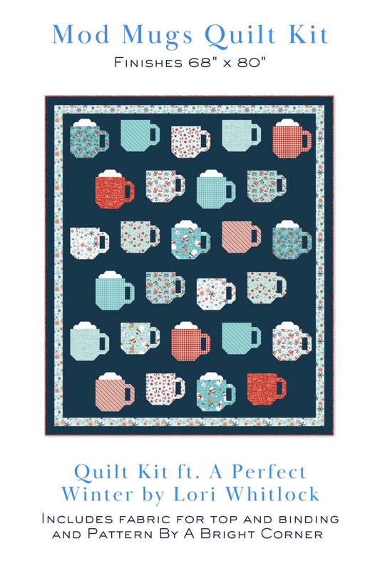 Mod Mugs Quilt Kit mockup featuring a colorful coffee mug quilt made with A Perfect Winter fabrics by Lori Whitlock for Riley Blake Designs. Kit includes fabric for the quilt top, binding, and pattern.