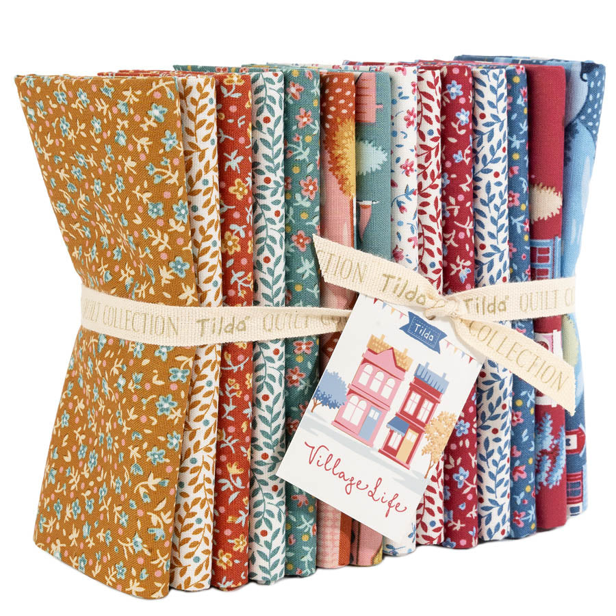 Pack of colorful fabric strips with a 'Tilda' label and 'Village Life' tag.  Contains 14 blenders.  