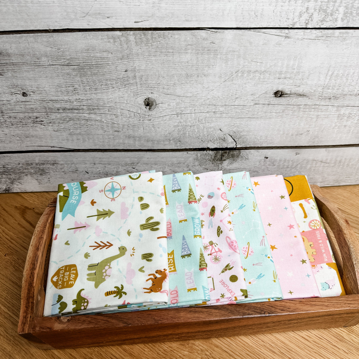 Six-piece Brave Your Way petite fat quarter bundle in Petal and Songbird pink and mint fabrics, by Cayla Naylor for Riley Blake Designs.