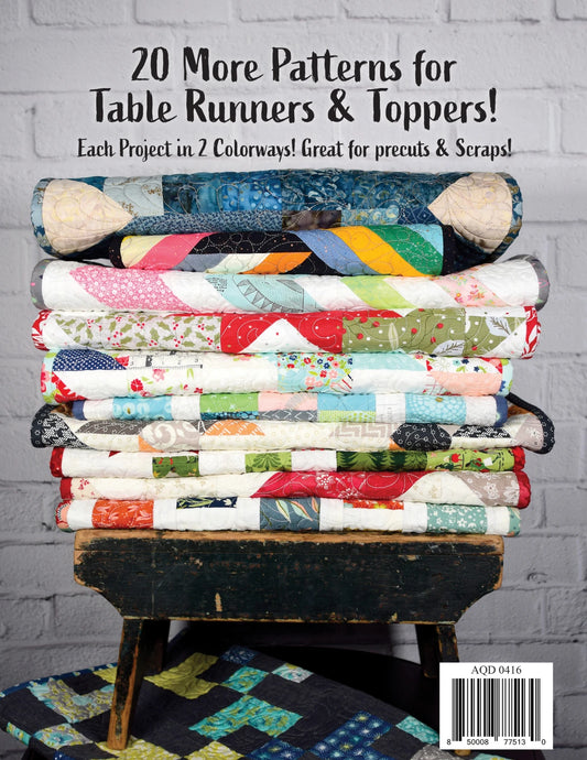 Tabletastic! 2 Pattern Book back cover with stack of quilted table runners.  