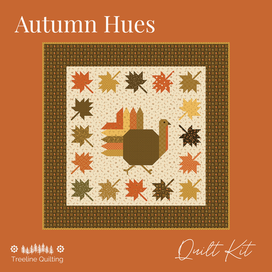 Autumn Hues quilt kit cover featuring a fall-themed quilt design with a turkey, maple leaves, and a patterned border on an orange background with Treeline Quilting branding.