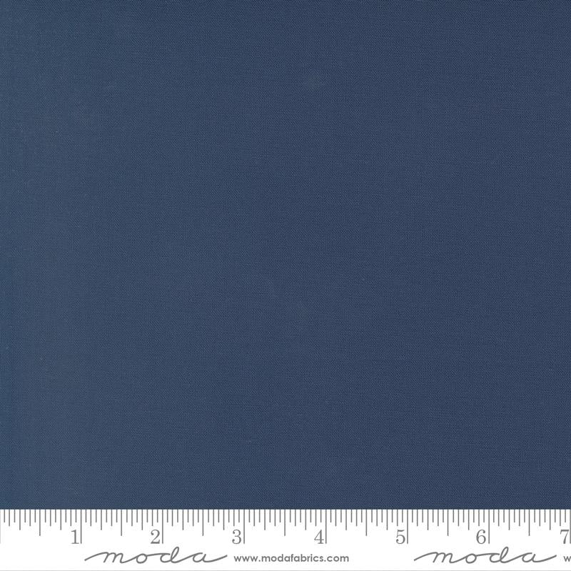 Bella Solid Nautical Blue fabric swatch with ruler