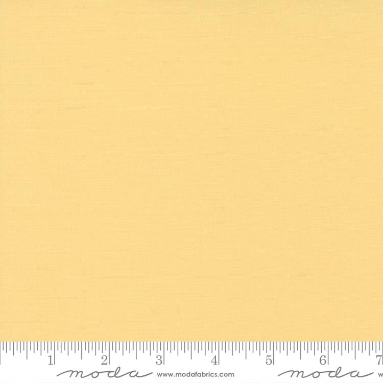 Bella Solids Soft Yellow fabric swatch with ruler