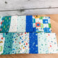 Seventeen-piece Brave Your Way fat quarter bundle by Cayla Naylor for Riley Blake Designs, featuring blue, teal, and green fabrics.