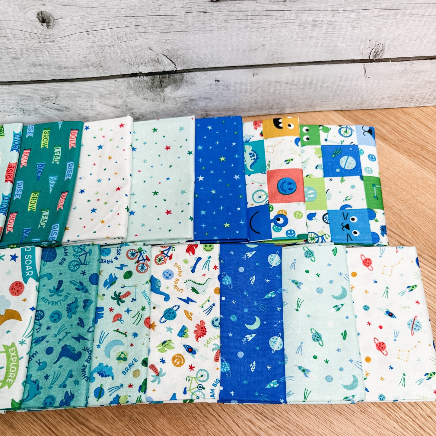 Seventeen-piece Brave Your Way fat quarter bundle by Cayla Naylor for Riley Blake Designs, featuring blue, teal, and green fabrics.