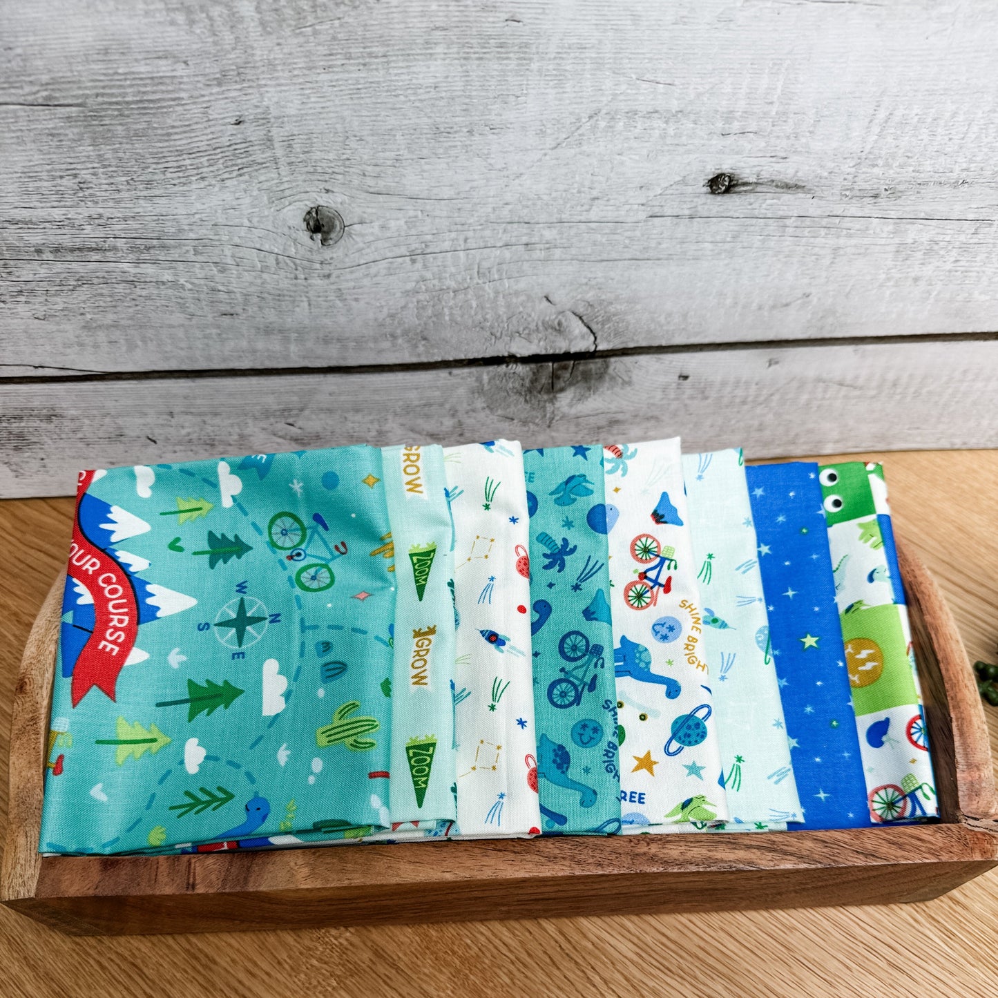 Eight-piece Brave Your Way petite fat quarter bundle featuring the Lagoon main print, by Cayla Naylor for Riley Blake Designs.