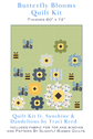 Butterfly Blooms quilt kit with floral and bee pattern on green background