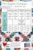 A fabric quilt pattern sheet titled 'Mini Brightly Holidays' showing a material requirements table with fabric options, finished quilt and block sizes, and a quilted patchwork preview. The brand 'Chick Luck Sew' is visible at the bottom.