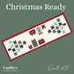 Christmas-themed table runner quilt kit cover featuring a long rectangular quilt design with red gingham borders, green and black star motifs, and gift shapes on a white background, set against a muted green backdrop with the text 'Christmas Ready' and 'Treeline Quilting'. Features the Evergreen Wishes fabric by Traci Reed.  
