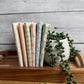 Handmade Sweetness Multi petite fat quarter bundle by My Sew Quilty Life for Moda Fabrics, featuring six coordinating prints displayed on a tray beside a decorative plant.
