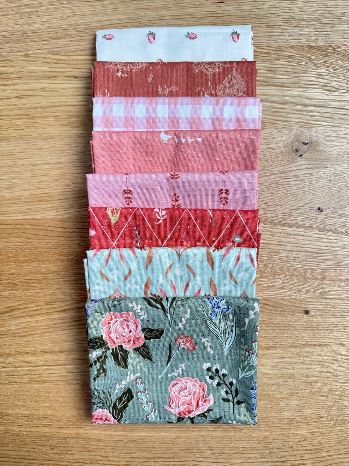 Flat lay of the Rosemary Hedgerow Haven petite fat quarter bundle, 8 fat quarters by Amber Elliot of Alderwood Studio for Riley Blake Designs