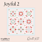 A quilt kit cover design for 'Joyful 2' quilt kit by Treeline Quilting, featuring a 3x3 grid of nine geometric and floral starburst quilt blocks in red, mint green, and beige on a light pink background, set against a solid pale pink backdrop.