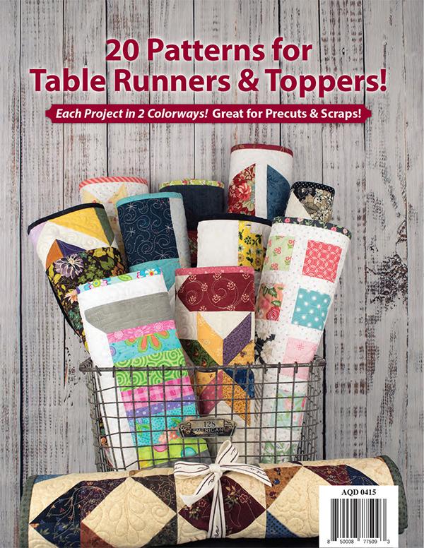 Tabletastic! back cover.  A quilted table runner and topper bundle displayed in a wire basket against a rustic whitewashed wood background. Large red text at the top reads '20 Patterns for Table Runners & Toppers!' with smaller supporting text about colorways and precuts/scraps.