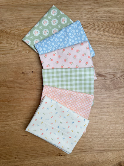 Six coordinating fat quarter prints from the Handmade Sweetness Multi bundle by My Sew Quilty Life for Moda Fabrics, fanned out to show the fabric designs.