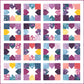 Joyful Stars quilt featuring colorful star blocks arranged in a modern geometric layout on a light background.