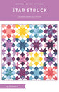 Star Struck quilt pattern cover by Cotton and Joy featuring a modern star quilt design made with fat quarters and bold geometric blocks.
