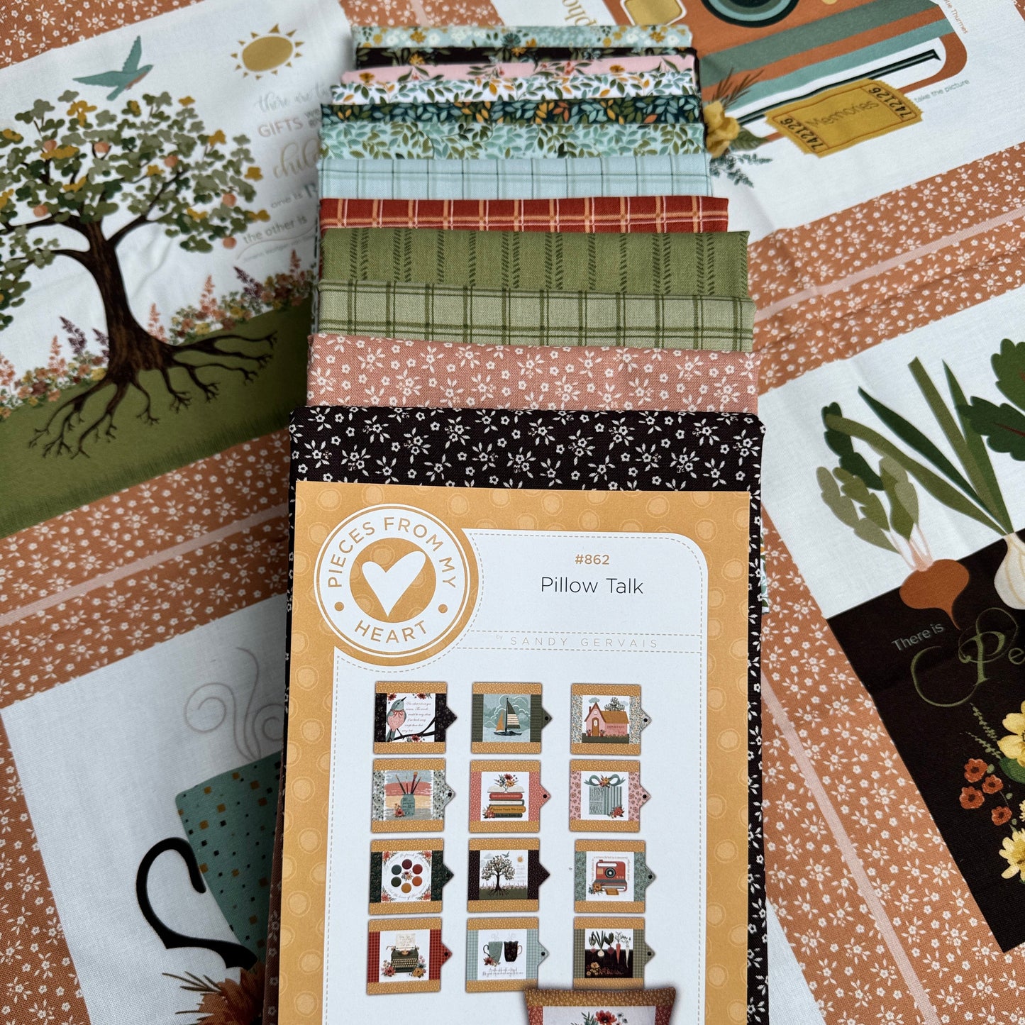 12 coordinating fabrics, quilt panel, and pattern to make the Pillow Talk pillow wraps.  Shown in the Worth Repeating fabric collection by Sandy Gervais.