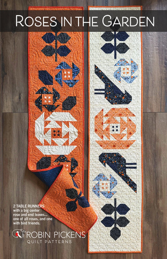 Roses in the Garden Table Runner Pattern – Robin Pickens pattern cover with two color options for the cross and flower table runner in orange or cream.  