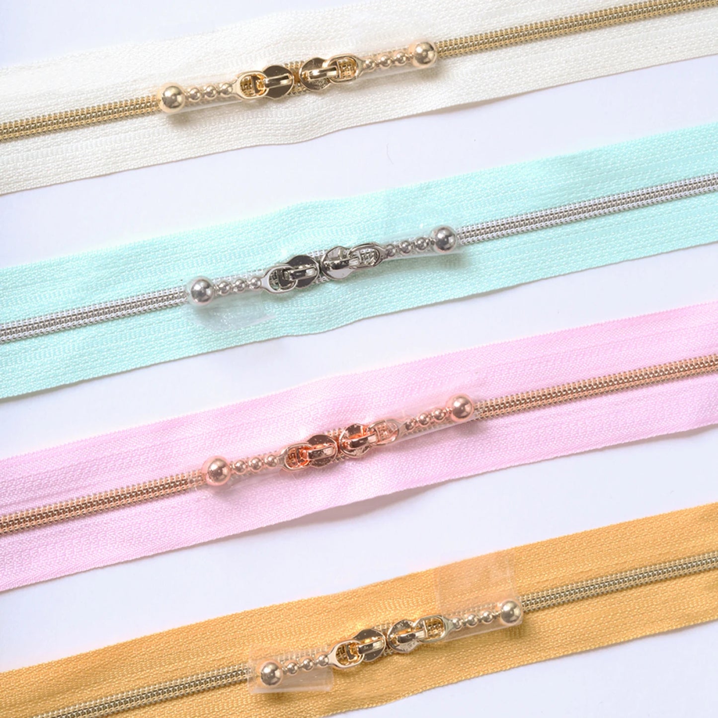 4 pastel zippers with double pulls.  20" length by Minki Kim of Sewing Illustration. 