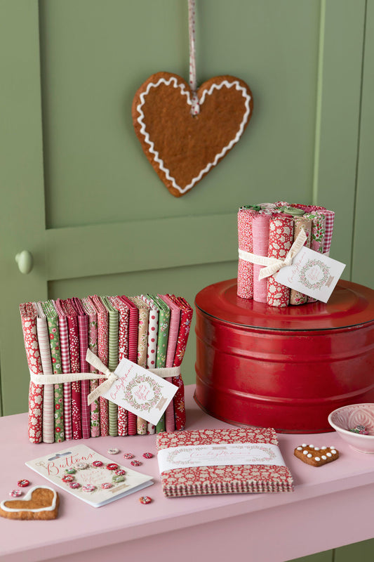 Stylized Tilda winter fabrics with matching accessories in the red and green color way