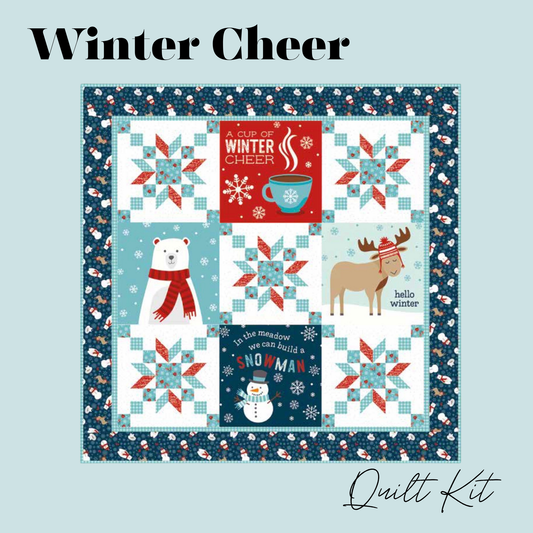 A quilt kit cover titled 'Winter Cheer' showing a square patchwork quilt design with winter-themed panels, including a polar bear, a moose, a snowman, and seasonal starburst patterns on a light blue background.  Features the quilt panel and coordinating fabrics from A Perfect Winter fabric collection.  