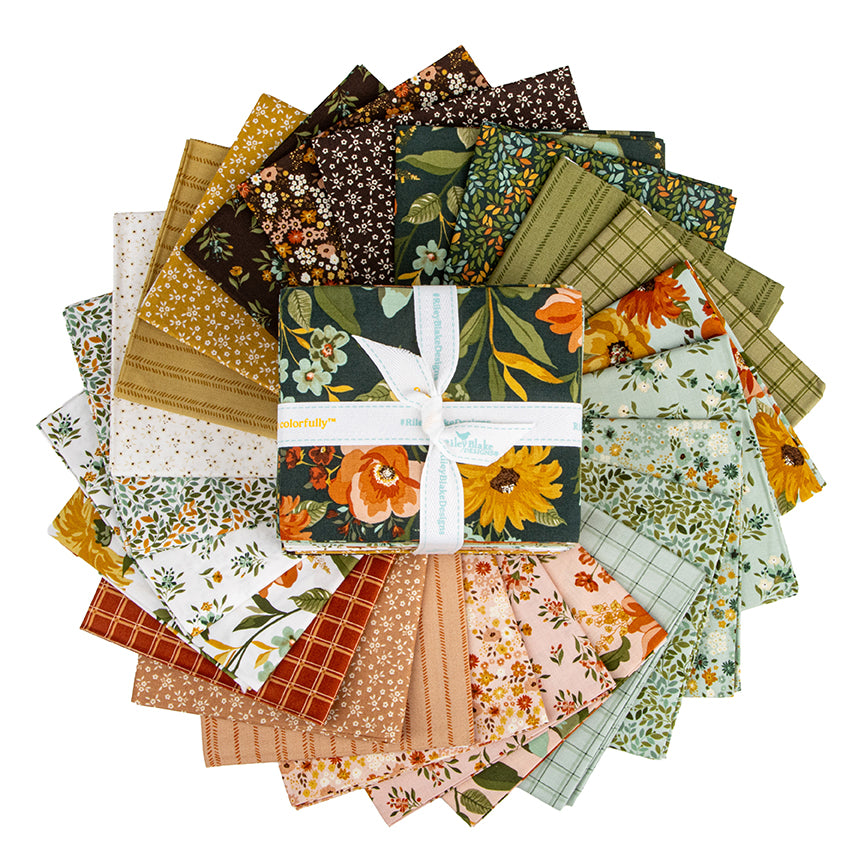 Fanned out fat quarters from the Worth Repeating fabric collection by Sandy Gervais