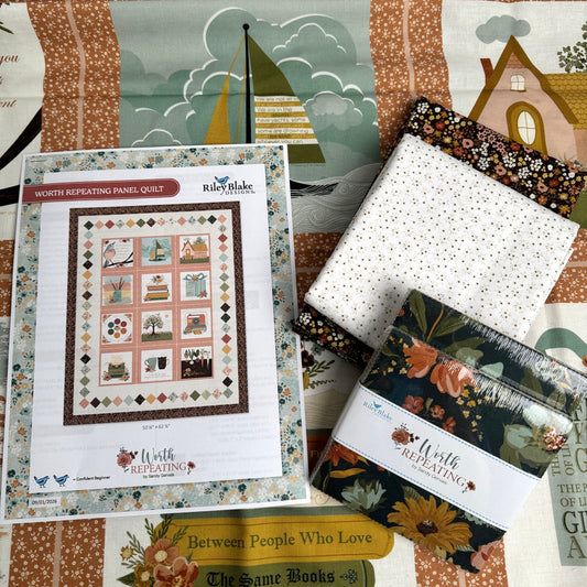 Worth Repeating by Sandy Gervais.  Kit contents shown with panel, yardage cuts, two charm packs, and a free printed pattern.  